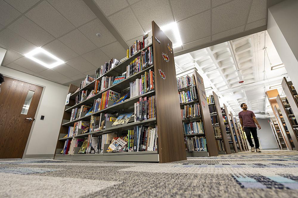 A student navigates ADA-accessible stacks.